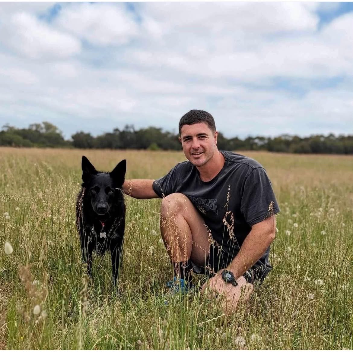 Matt Ashbolt, owner of Oceanside Fencing Management, with his dog in Perth, Western Australia